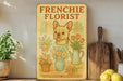 a frenchie florist sign on a shelf next to a potted plant