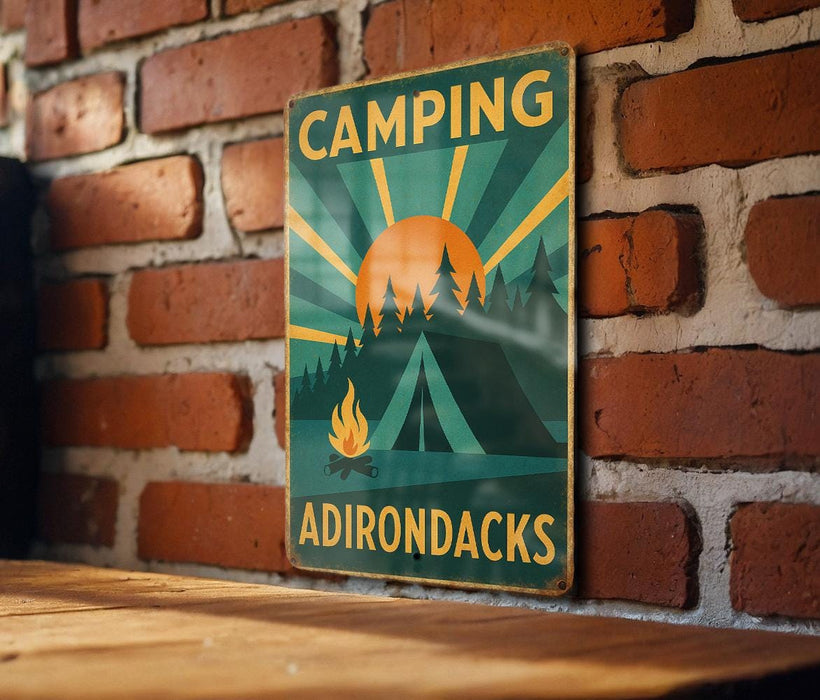 a sign on a brick wall that says camping adirondacks