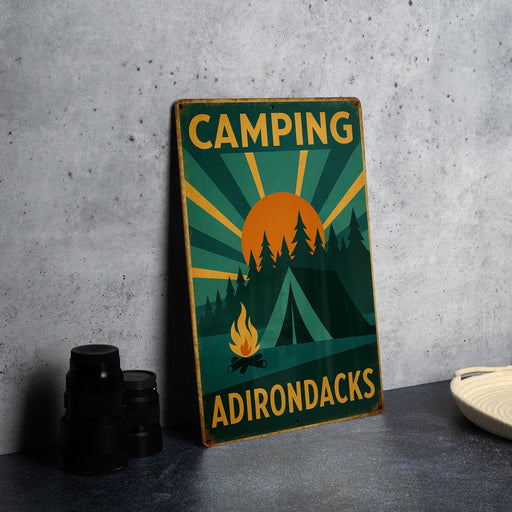 a camping sign sitting on top of a table