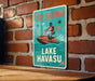 a sign on a brick wall that says just skiing lake hawasu