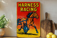 a picture of a horse racing sign on a shelf