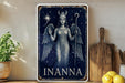 a metal sign with an angel holding a staff