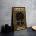 a black rose book sitting on top of a table