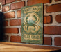 a close up of a sign on a brick wall