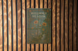 a book is hanging on a wooden wall