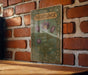 a picture of a flower on a brick wall