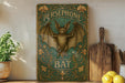 a picture of a bat hanging on a wall