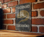 a picture of a sign on a brick wall