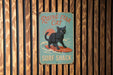 a sign on a wooden wall that says rising star cat surf shack