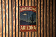 a sign on a wooden wall that says stargazing arizona