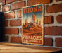 a picture of a sign on a brick wall