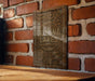 there is a sign on a brick wall