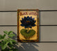 a picture of a black lotus on a wall
