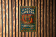 a sign on a wooden wall that says lincoln cavern pennsylvania