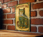 a picture of a cat on a brick wall