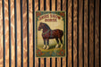 a poster of a horse on a wooden wall