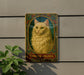 a picture of a cat on the side of a building