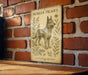a picture of a dog on a brick wall