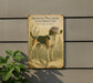 a sign on the side of a building advertising a treeing walker coonho