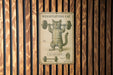 a sign on a wooden wall with a picture of a cat lifting a barbell