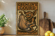 a picture of a gremlin's gourd sign on a shelf
