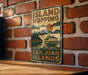 a sign on a brick wall that says island hopping