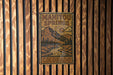 a wooden wall with a sign hanging on it