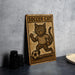 a wooden sign with a cat on it