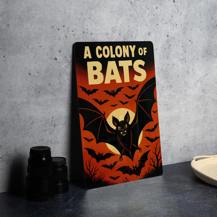 A poster with the title "A COLONY OF BAT" and an illustration of bats against a red background.