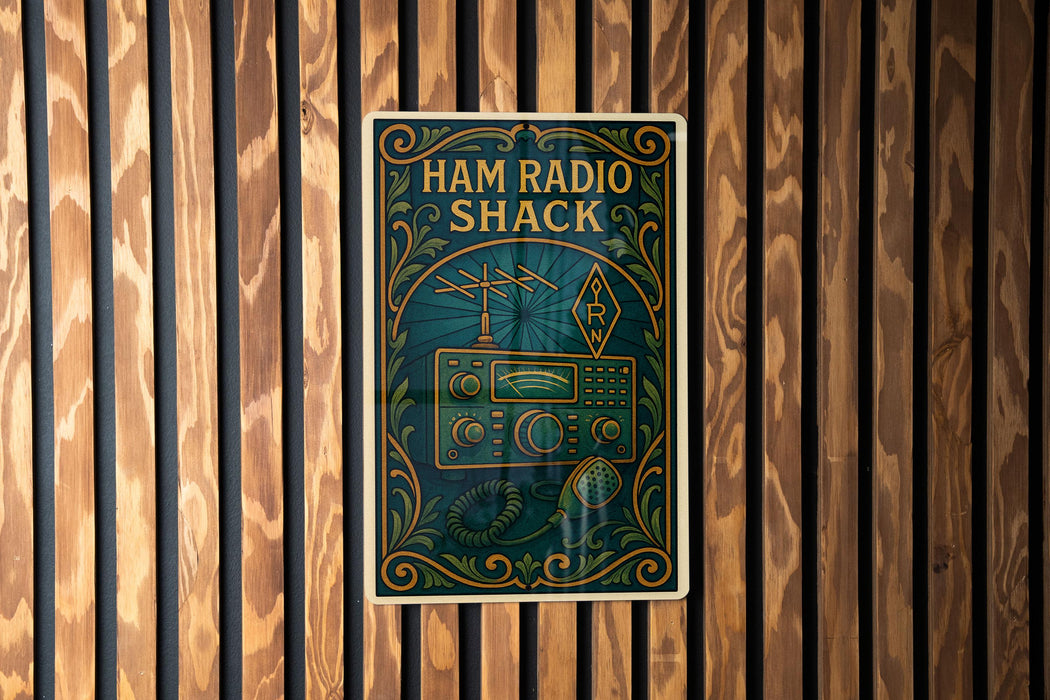 A vintage-style poster for Ham Radio Shack, featuring an antenna and radio equipment, is displayed on a wooden wall.