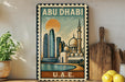 a framed poster of the skyline of Abu Dhabi, with a mosque and skyscrapers in the background, displayed on a shelf next to a wooden cutting board and a potted plant.