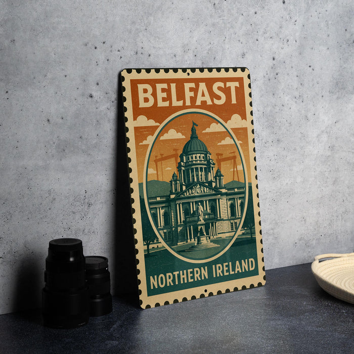 A metal sign with the text "BELFAST NORTHERN IRELAND" and an illustration of a building, likely representing the Belfast Northern Ireland region.