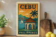 a vintage-style poster of Cebu, the capital city of the Philippines, with a tropical landscape and a small building. The poster is displayed on a wall, and there are some kitchen utensils, such as a cutting board and a knife, as well as some decorative elements like a potted plant and a lemon, in the foreground.