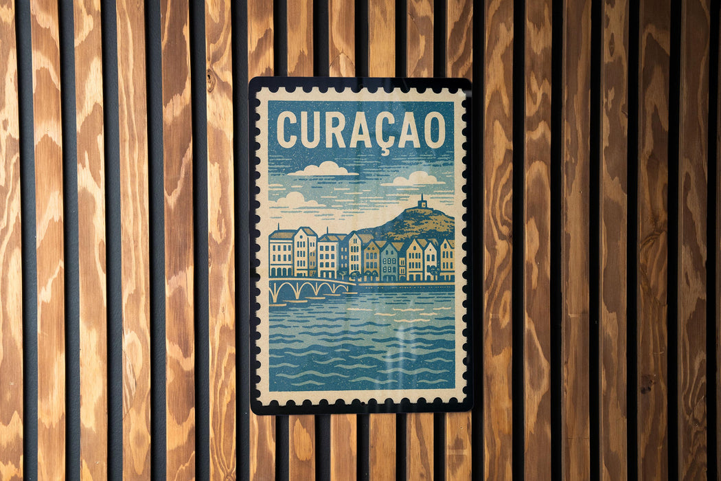 A vintage postage stamp featuring a cityscape with a river and buildings, hanging on a wooden wall.