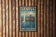 A vintage-style postage stamp from Switzerland featuring a cityscape and a tall tower, mounted on a wooden wall.