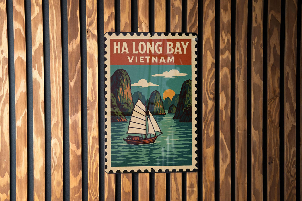 A vintage-style poster of Ha Long Bay, Vietnam, featuring a sailboat on the water and surrounded by mountains.