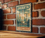 A vintage-style metal sign with the text "JAKARTA INDONESIA" displayed on a brick wall.