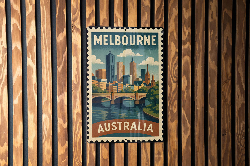 A vintage-style postage stamp from Melbourne, Australia, featuring a cityscape and a bridge, is displayed on a wooden wall.