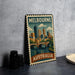 A vintage-style metal stamp depicting the Melbourne skyline, with the text "Melbourne Australia" prominently displayed.