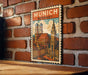 A vintage-style postage stamp depicting the city of Munich, Germany, with the text "MÜNICH GERMANY" prominently displayed.