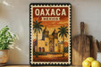 A framed vintage-style poster of Oaxaca, Mexico, featuring a colorful illustration of a church with palm trees and mountains in the background.