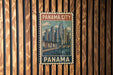 A vintage-style postage stamp depicting the Panama City skyline, with the text "Panama City" prominently displayed.