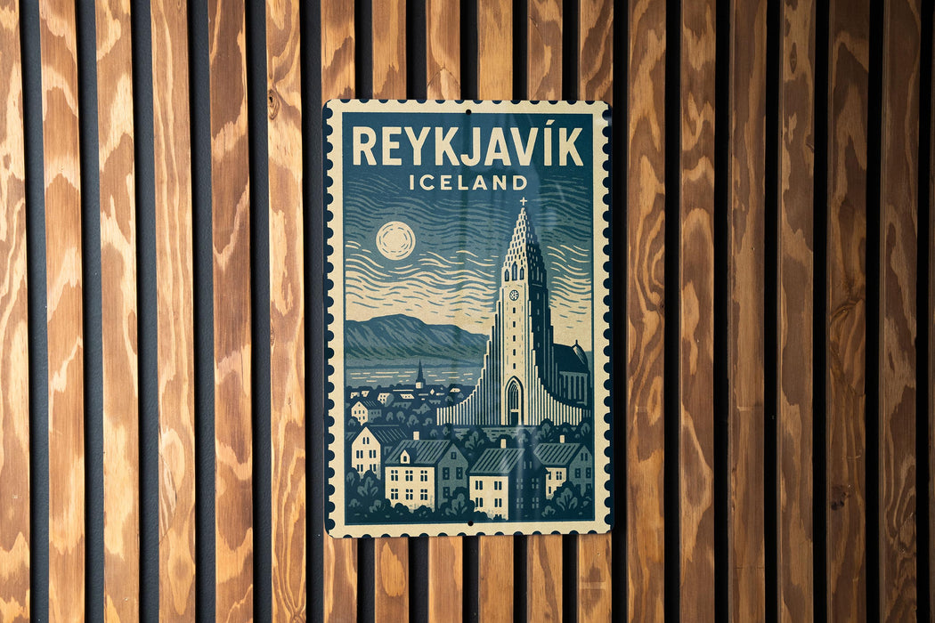 A vintage-style postage stamp from Iceland featuring a cityscape with a church spire and mountains in the background.