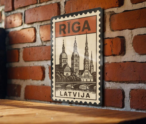 A vintage-style metal sign with a brick wall backdrop, featuring a drawing of a city skyline and the word "Riga" prominently displayed.