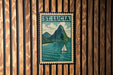 A vintage postage stamp depicting St. Lucia, featuring a sailboat on the water and a mountain in the background.