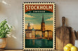 A vintage-style metal sign depicting the city of Stockholm, Sweden, with a castle and a bridge in the background.