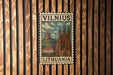 A postage stamp featuring a castle and a hill in the background, with the text "VILNIUS LITHUANIA" prominently displayed.