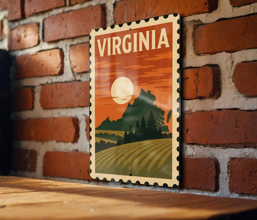 A vintage-style metal sign with the word "VIRGINIA" prominently displayed, featuring a landscape with a mountain, field, and sunset.