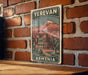 A vintage-style sign with the text "YEREVAN ARMENIA" is displayed on a brick wall, featuring an illustration of a cityscape with a mountain in the background.