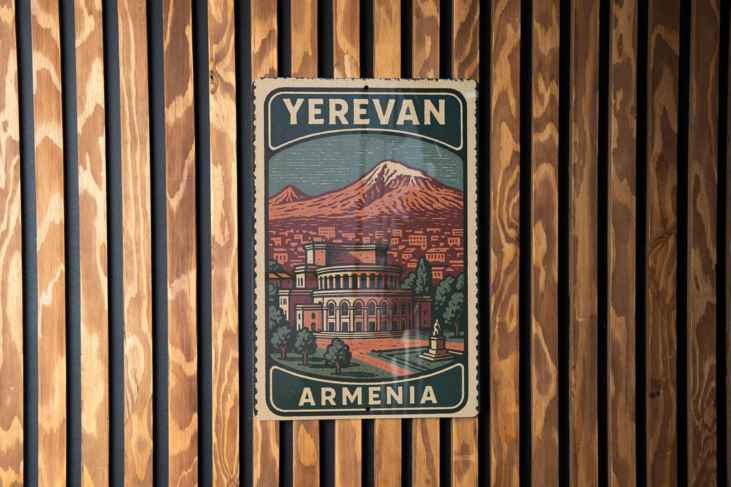 A vintage-style poster of Armenia, featuring a mountain landscape and a building, is displayed on a wooden wall.